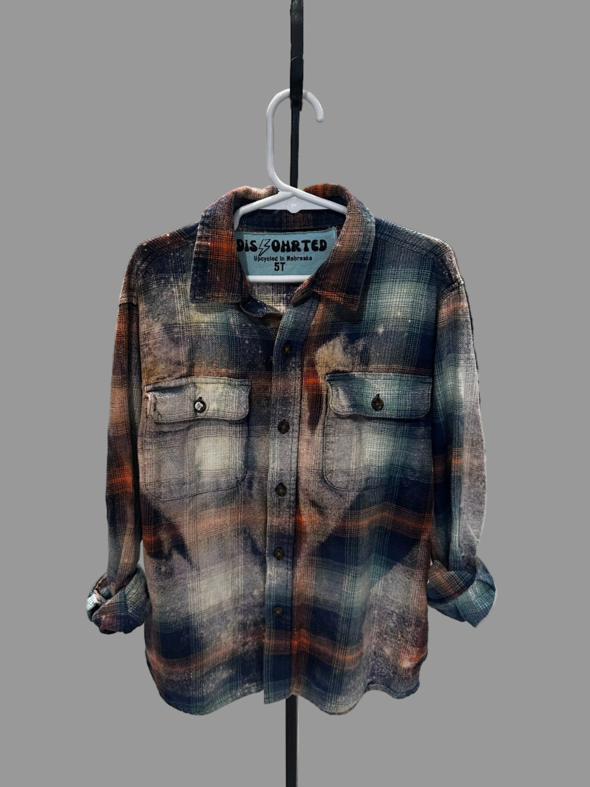 Plaid shirt on a rack with a blurred background