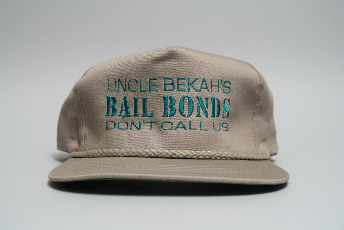 Kahaki Trucker Hat with "Uncle Bekah's Bail Bonds" on it