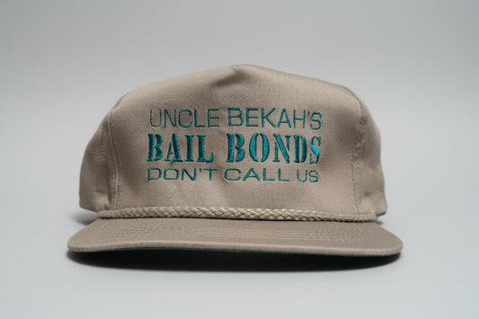 Kahaki Trucker Hat with "Uncle Bekah's Bail Bonds" on it