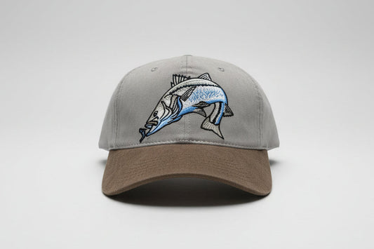 Gray front with fish design hanging on an army green bill. vintage cotton hat